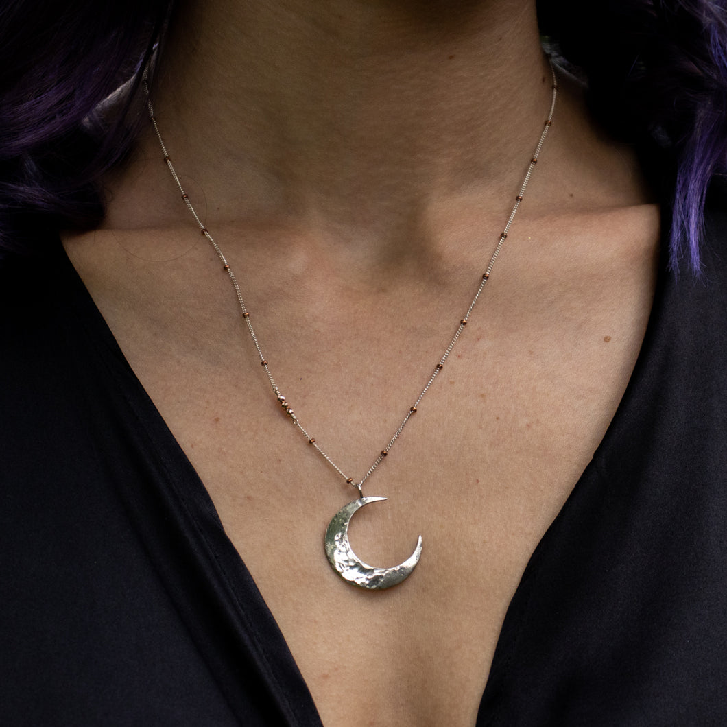 silver crescent moon necklace with rose pyrite